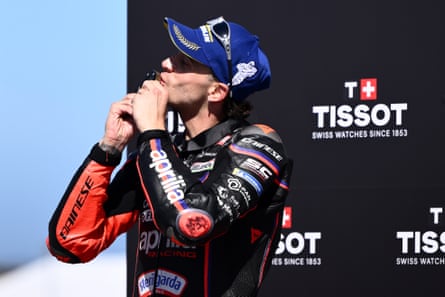 Bezzecchi celebrates on the podium after his sprint win