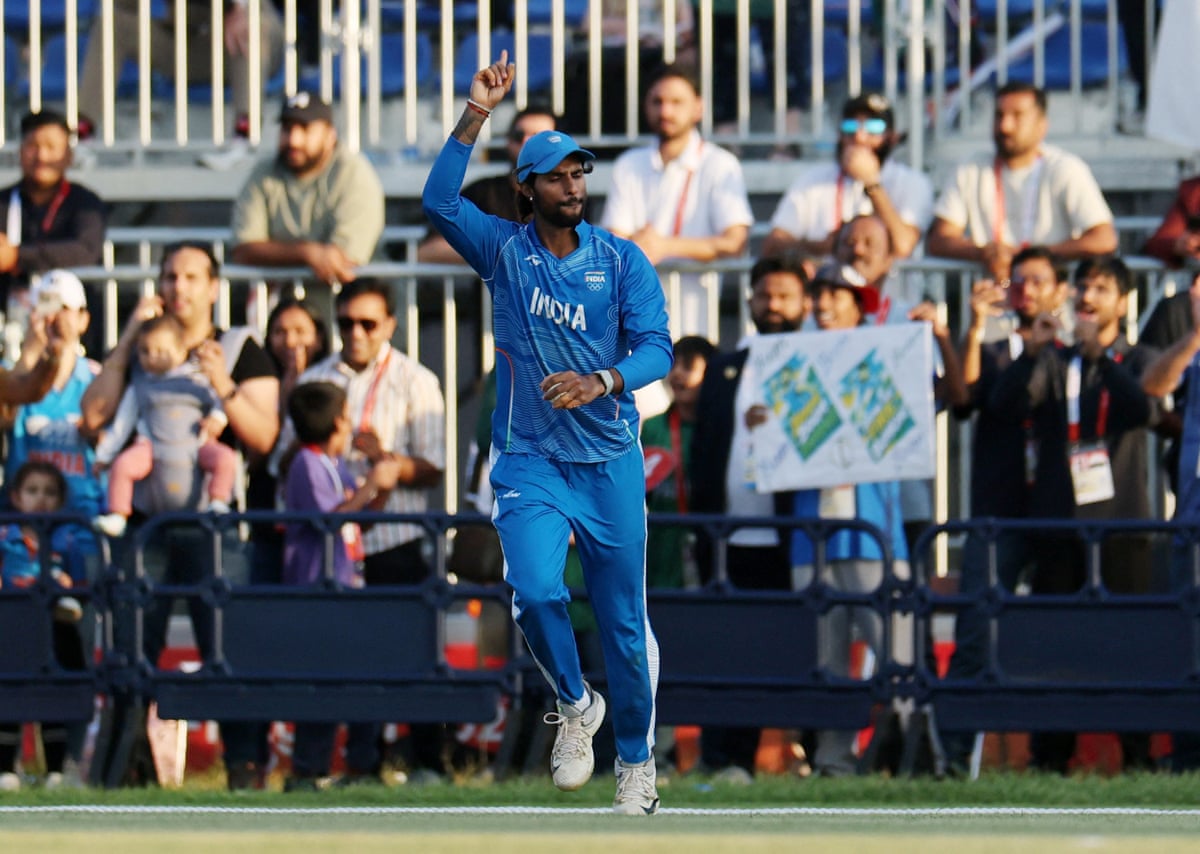 Tilak Varma celebrates after taking a catch