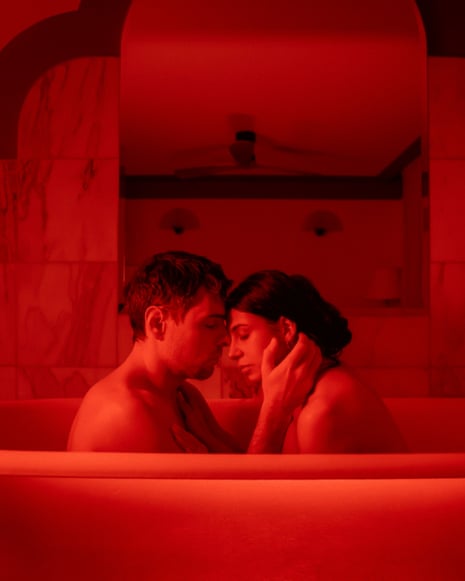 two people sitting in a bathtub
