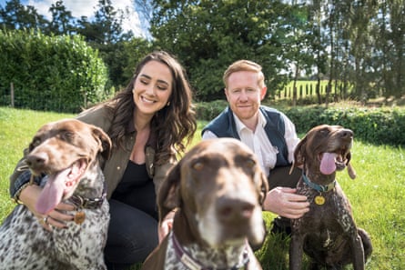Molly and Neil Sands, the couple of unmasked the man behind the Tattle Life website, with three dogs