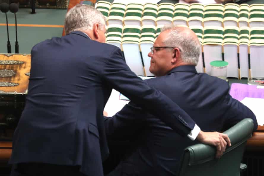 Prime minister Scott Morrison talks with deputy PM Michael McCormack during question time