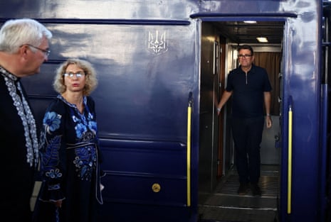 Ukraine’s foreign minister, Andrii Sybiha, prepares to greet Andy Burnham upon his arrival by train in Kyiv on 24 August 2026.