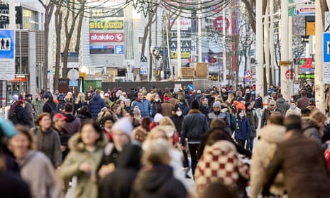 A busy shopping street in Vienna, Austria. From Saturday, people must wear masks outside.