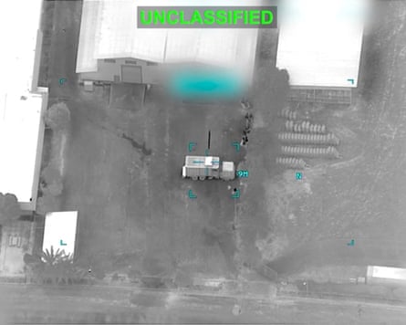 A black-and-white aerial shot of a missile strike