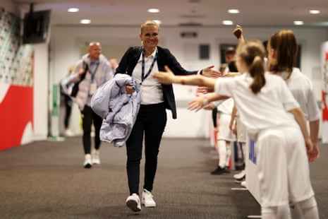 England boss Sarina Wiegman welcomes her welcoming committee as they arrive at Wembley Stadium.