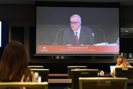 Scott Morrison seen on a screen giving testimony before the robodebt inquiry