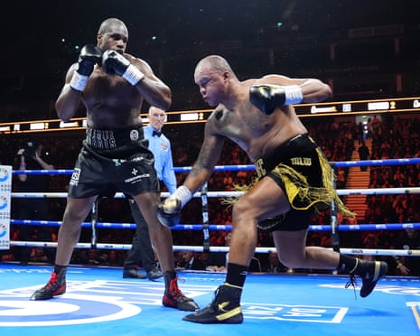 Daniel Dubois (left) punches Fabio Wardley during their WBO heavyweight title rematch.