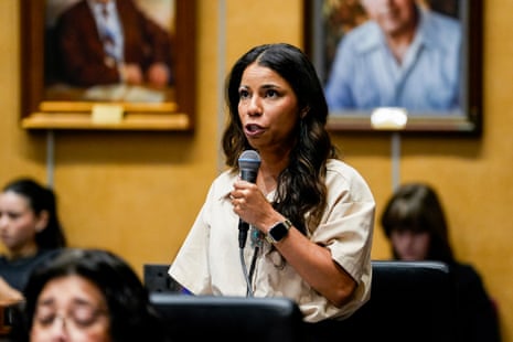 a woman speaks into a microphone