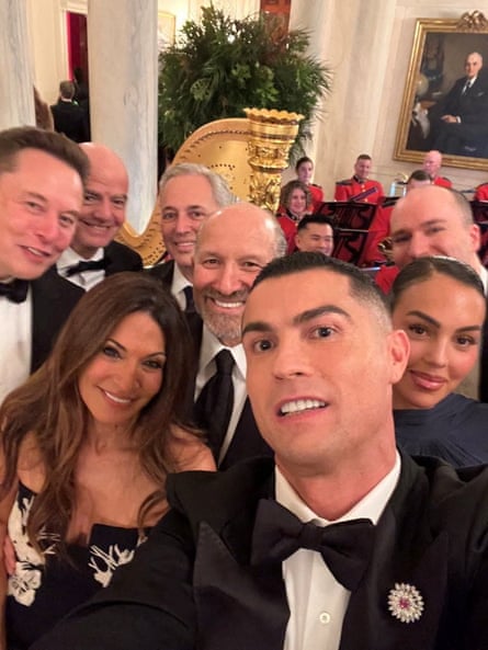 Cristiano Ronaldo takes a selfie with Georgina Rodríguez (front left), Elon Musk (left) and Gianni Infantino (second left)