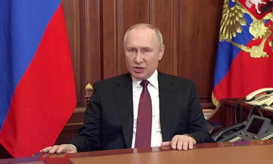 Vladimir Putin speaks about authorising a military operation in Ukraine's Donbas region during a televised address on Russian state TV on Thursday. 
