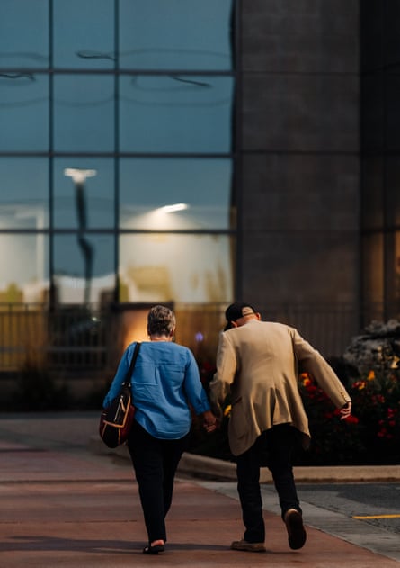 Two pedestrians walk hand in hand into the Parkview Regional Medical Center