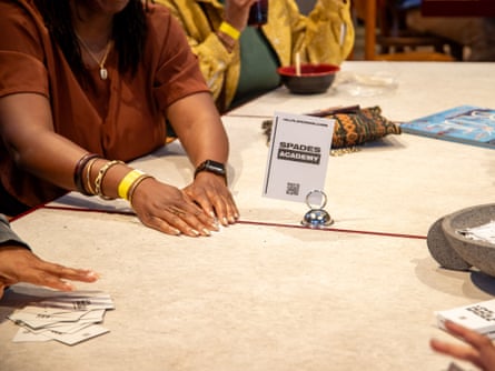 a woman holding cards