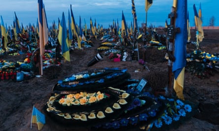Viktor Shulik’s grave in a makeshift cemetery for fallen Ukrainian soldiers in Kharkiv.