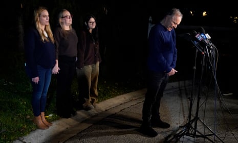 Uri Raanan, right, pauses as he talks to media, with his sister Sigal Zamir, left, wife Paola Raanan, centre, and her daughter Frida Alonso