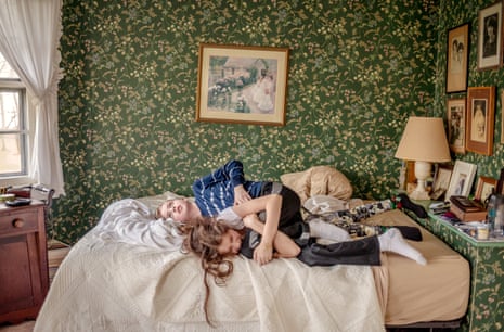 Graham, a boy on the autism spectrum, wrestling on a bed with his cousin, 2015
