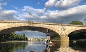 Paddleboarding by Putney bridge over the Thames