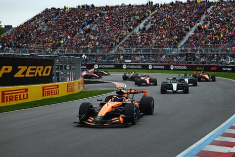 Lando Norris leads into the first corner!