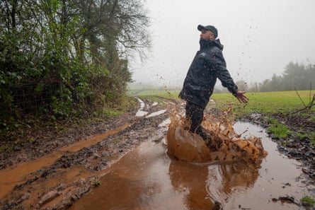Jon Barrett splashing in mud