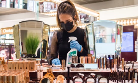 A member of staff at Peter Jones cleans makeup items
