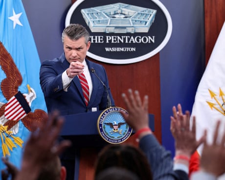 a man points to a people raising their hands a man points to a people raising their hands