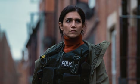 Leila Farzad as DI Lou Slack in BBC One crime drama Better standing in uniform in a street of red-brick houses