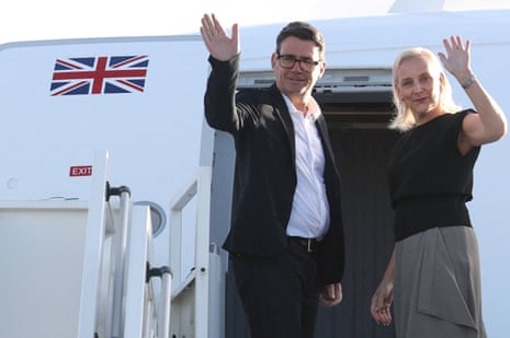Andy Burnham and his wife, Marie-France van Heel, boarding their flight to New York yesterday.