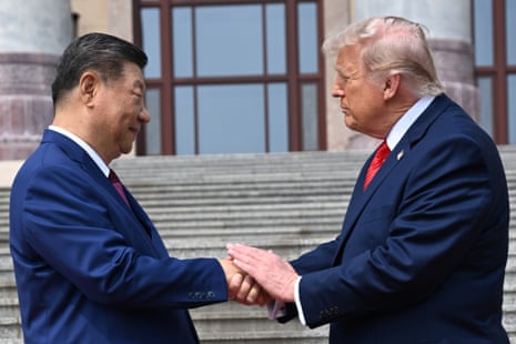 Xi Jinping shakes hands Donald Trump at the Great Hall of the People in Beijing.