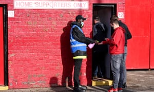 A fan gets his hands sprayed before entering Oakwell.