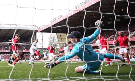 Nottingham Forest’s Dean Henderson saves a header from Liverpool’s Virgil van Dijk.