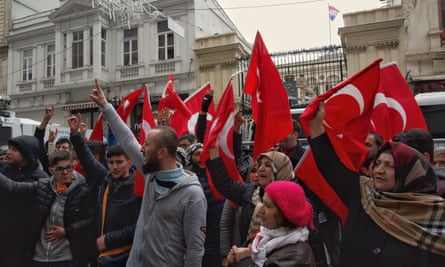Demonstrators wave Turkish flags outside the Consulate of Netherlands in Istanbul