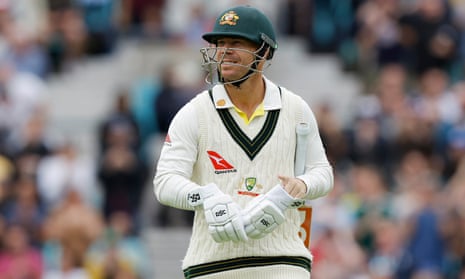Australia's David Warner walks off the pitch after losing his wicket to England's Chris Woakes.