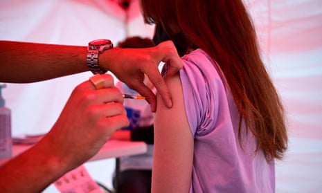A young person is vaccinated today at an outdoor centre at Republique square in Paris.