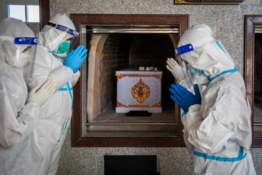 Volunteers helping at a hospital morgue during the pandemic in Bangkok, Thailand.