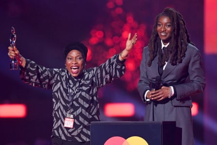 Little Simz accepts the Best New Artist award alongside her mother during The BRIT Awards 2022 at The O2 Arena on February 08, 2022 in London, England