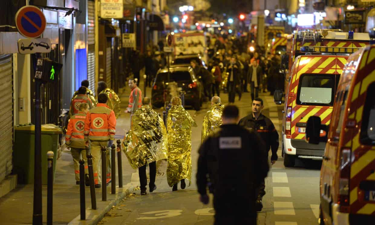 People being evacuated near the Bataclan concert hall in Paris