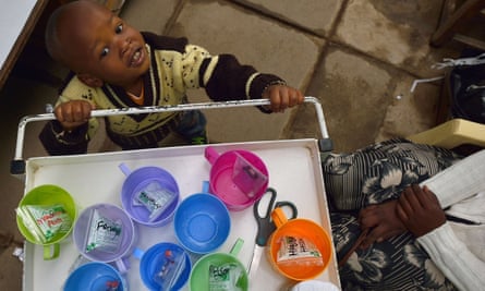 John, 3, who suffers from multi-drug-resistant tubeculosis (MDR-TB), plays with a medicine trolley next to his mother Elizabeth, also an MDR-TB case, at a Medecins Sans Frontieres (MSF)-run clinic in Nairobi, 2015
