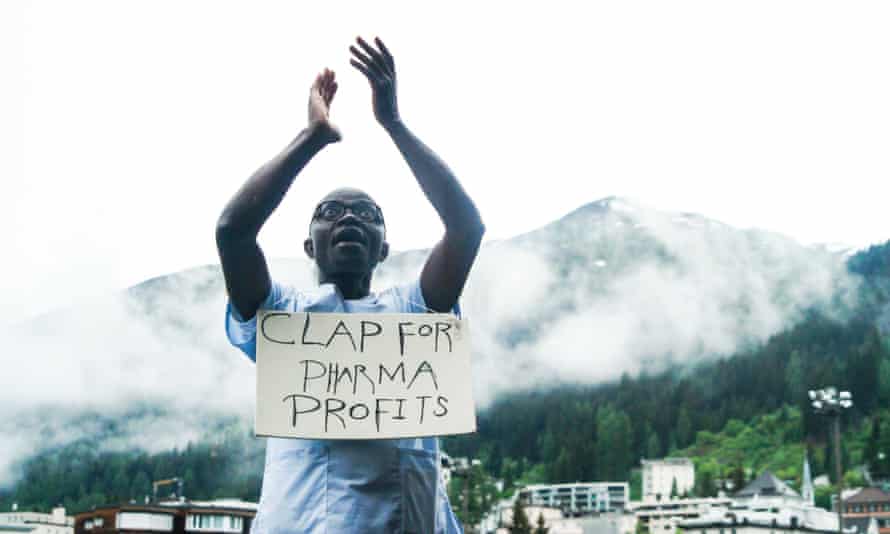 At the World Economic Forum in Davos, George Poe Williams, a nurse from Liberia, stages a protest against the profits made by drugmakers.