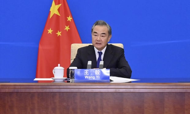 Chinese Foreign Minister Wang Yi meets with US Special Presidential Envoy for Climate John Kerry, not shown, via video link in China. Wang warned Kerry on Wednesday that deteriorating US-China relations could undermine their cooperation on climate change.
