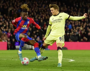 Wilfried Zaha of Crystal Palace is fouled in the box by Arsenal’s Martin Odegaard.