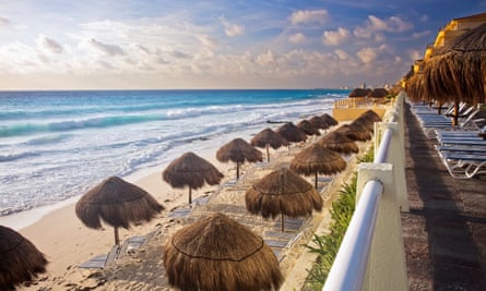 The turquoise waters and white sand beaches of Cancún. For workers drawn from impoverished southern states, wages are low.