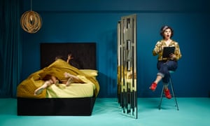 A couple in bed and Caitlin Moran sitting behind a screen looking shocked