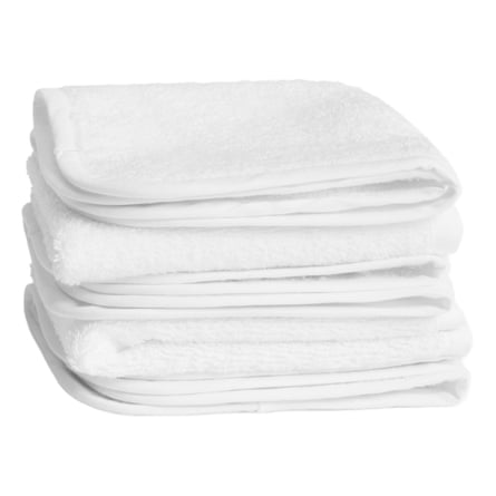 Set of five white flannels, piled