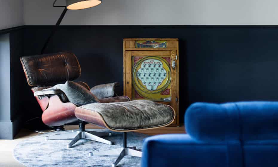 Original thinking: a first-edition Eames chair and arcade machine in a relaxing space.