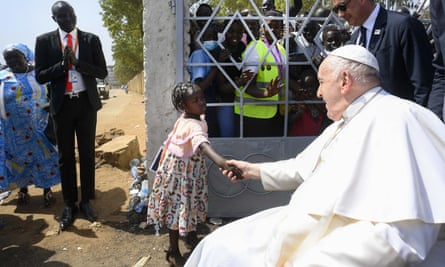 The pope greeting a young girl in Juba.