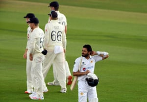 Pakistan’s Azhar Ali walks off the pitch after being dismissed by England’s James Anderson.