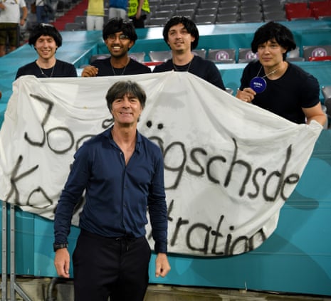 A relieved looking Joachim Löw poses with some of his fans.