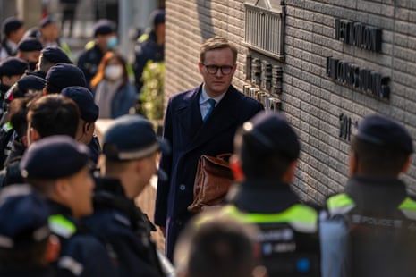 Matthias Kauffman, deputy head of the European Union Office to Hong Kong and Macao, arrive at the courthouse as officers stand guard, Monday, Feb. 9, 2026.