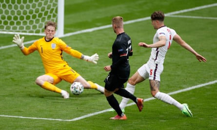 Jordan Pickford saves Timo Werner’s shot in England’s last-16 game against Germany.