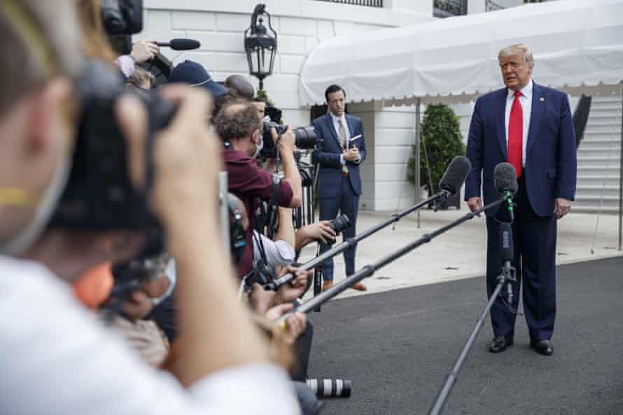 Donald Trump speaks to the media before boarding Marine One on 10 July to head to coronavirus-stricken Florida as he ramps up public appearances ahead of the election.