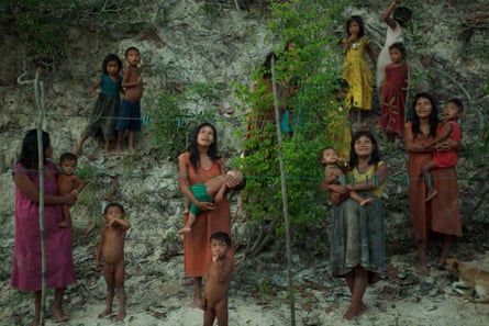 Production still from Tawai showinh women holding small children.